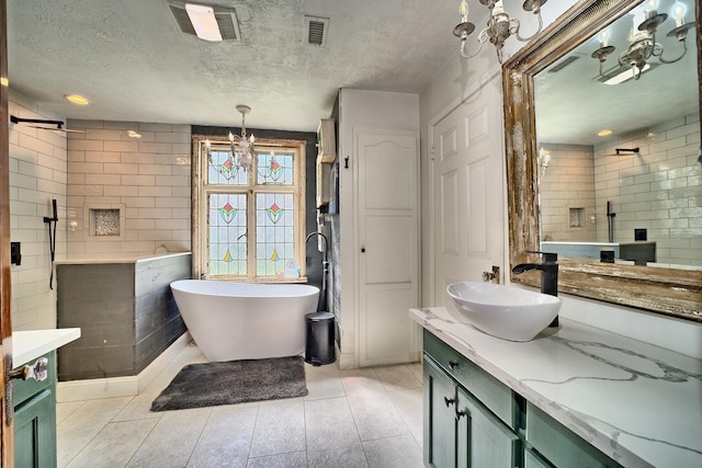 bathroom featuring vanity, shower with separate bathtub, tile walls, and a textured ceiling