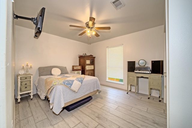 bedroom featuring ceiling fan and light wood-type flooring