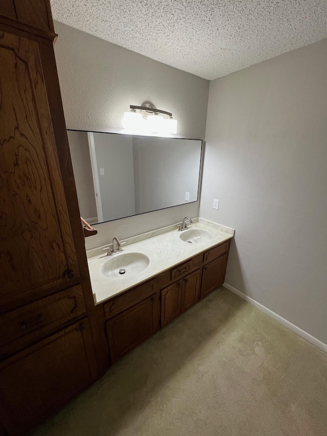 bathroom featuring vanity and a textured ceiling