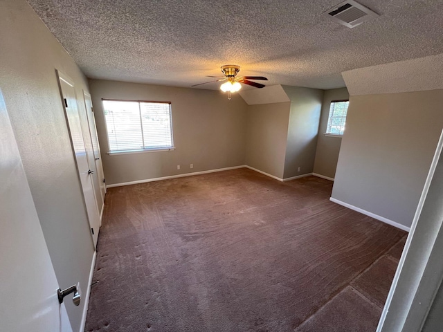 interior space featuring a textured ceiling, plenty of natural light, and ceiling fan