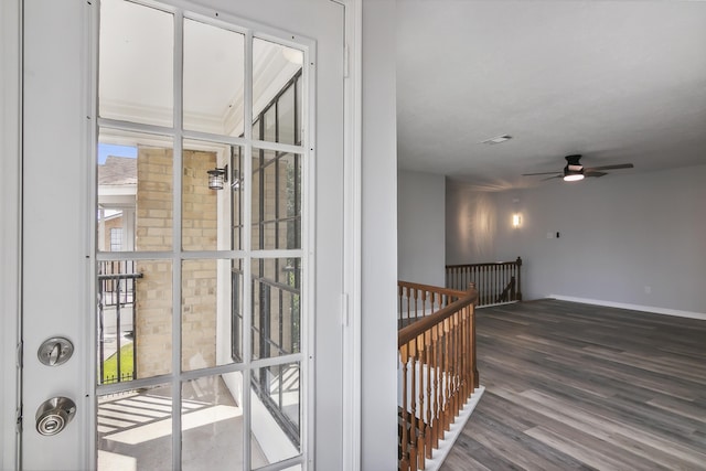 interior space featuring wood-type flooring and ceiling fan