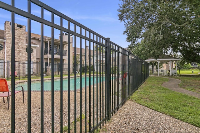 view of pool featuring a gazebo and a lawn