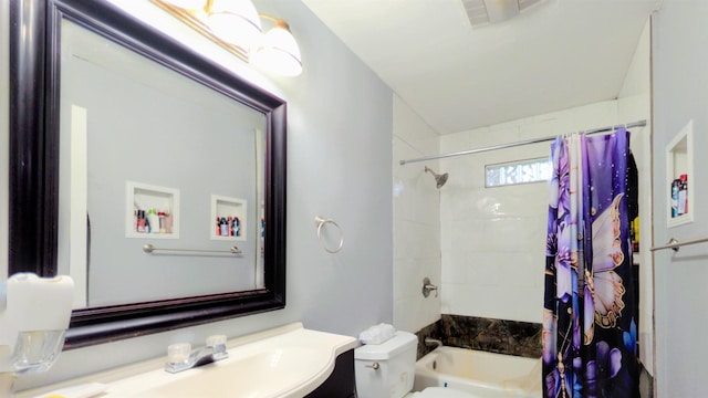 255 Smelker St, Beaumont, TX 77707 - bathroom featuring toilet, vanity, and shower / bath combo with shower curtain