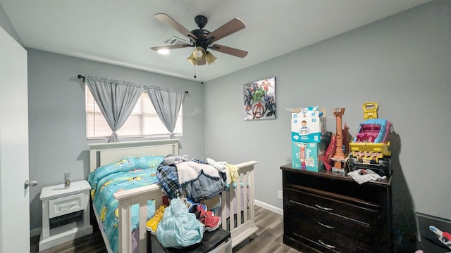 255 Smelker St, Beaumont, TX 77707 - bedroom featuring wood finished floors, baseboards, and ceiling fan