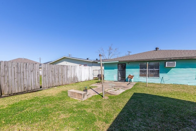 back of property with a patio area, fence, and a lawn