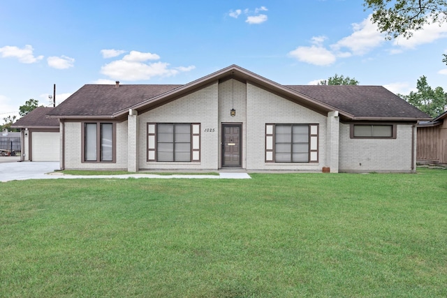 mid-century home featuring brick siding, a shingled roof, and a front yard