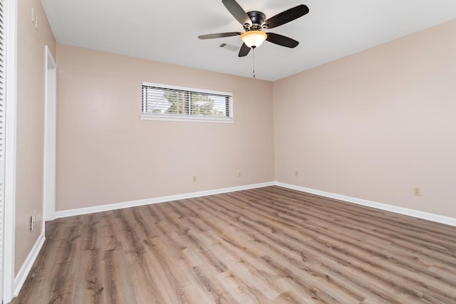 unfurnished bedroom featuring visible vents, ceiling fan, baseboards, and wood finished floors