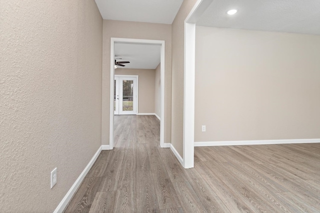 hall with light wood-type flooring