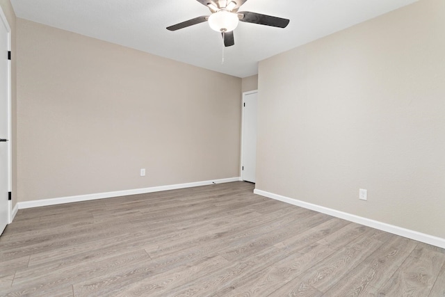 unfurnished room with ceiling fan and light hardwood / wood-style flooring