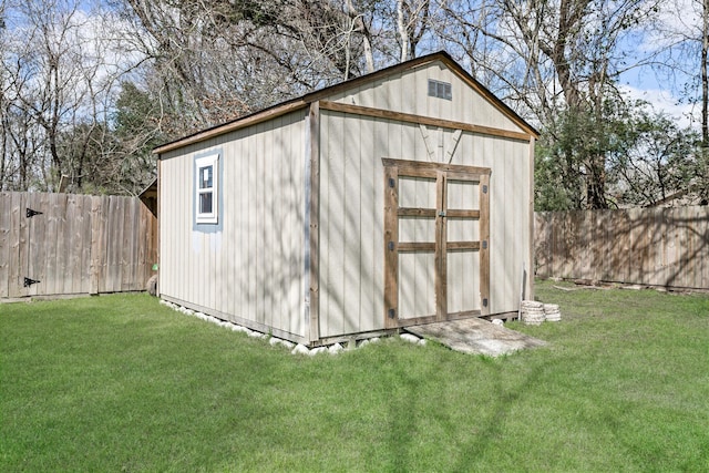 view of shed with a fenced backyard