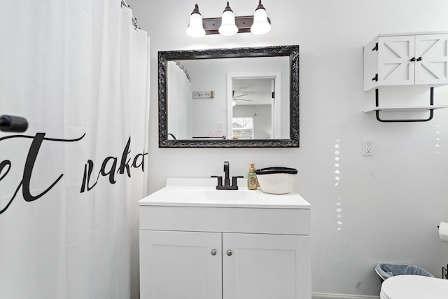 full bathroom with vanity and toilet