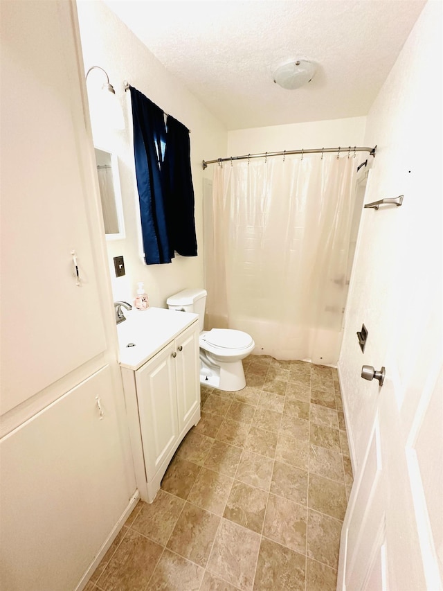 bathroom with vanity, a textured ceiling, toilet, and a shower with shower curtain