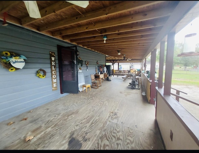 wooden deck with a porch and ceiling fan