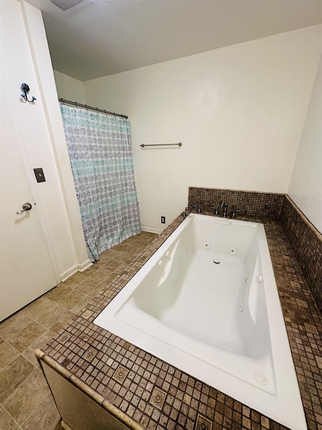 bathroom with tiled bath