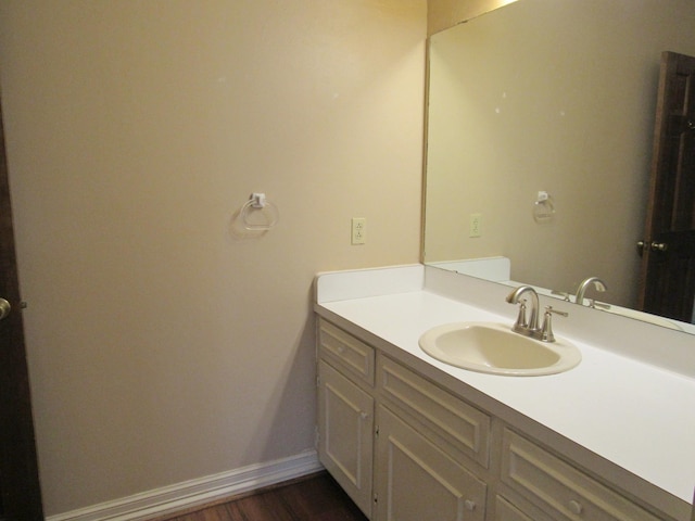 620 20th St, Beaumont, TX 77706 - bathroom featuring vanity and wood finished floors