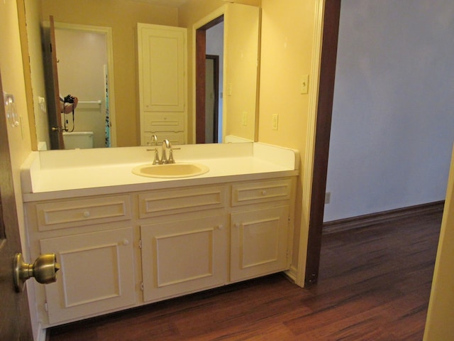 620 20th St, Beaumont, TX 77706 - bathroom featuring wood finished floors and vanity