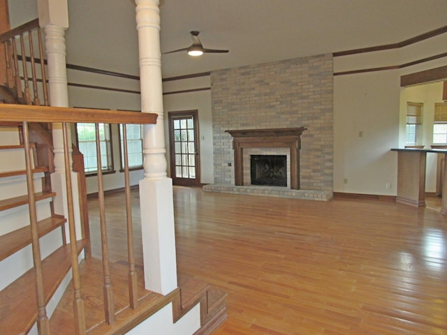 620 20th St, Beaumont, TX 77706 - unfurnished living room featuring a ceiling fan, wood finished floors, and plenty of natural light