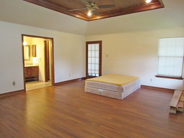 620 20th St, Beaumont, TX 77706 - unfurnished bedroom with a raised ceiling, wood finished floors, wood ceiling, and connected bathroom