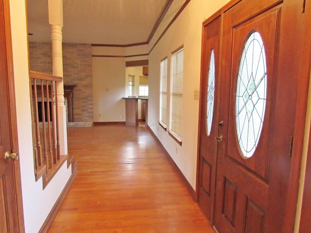 620 20th St, Beaumont, TX 77706 - foyer with light wood-type flooring and crown molding