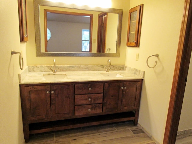 620 20th St, Beaumont, TX 77706 - full bath with double vanity and wood finished floors
