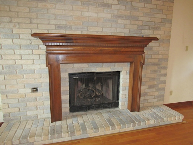 620 20th St, Beaumont, TX 77706 - detailed view of a fireplace with raised hearth and wood finished floors