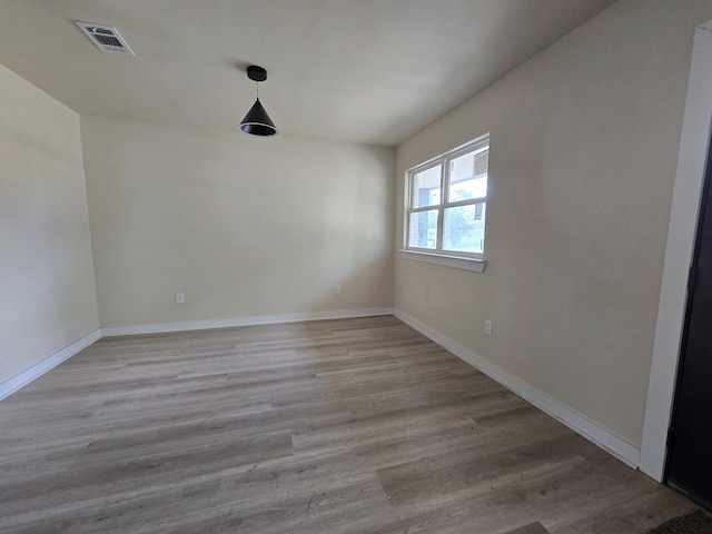3435 Kenwood Dr, Beaumont, TX 77706 - spare room featuring baseboards, visible vents, and light wood-style floors