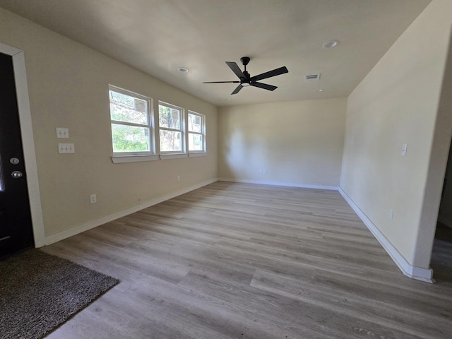 3435 Kenwood Dr, Beaumont, TX 77706 - unfurnished room with baseboards, visible vents, a ceiling fan, and wood finished floors