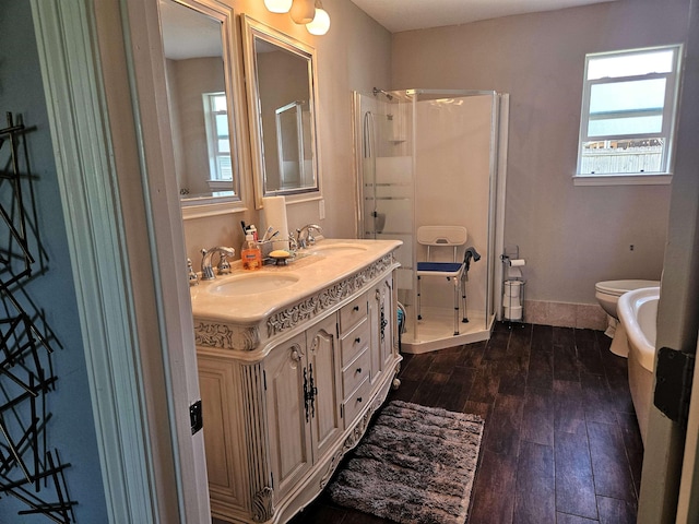 250 Lamesa Dr, Bridge City, TX 77611 - bathroom with a shower stall, toilet, hardwood / wood-style flooring, and a sink