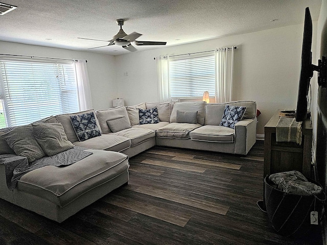 250 Lamesa Dr, Bridge City, TX 77611 - living area featuring wood finished floors, visible vents, a ceiling fan, and a healthy amount of sunlight