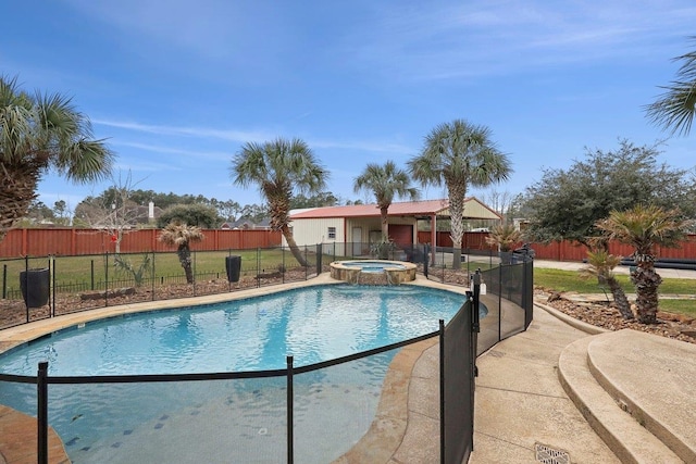 view of pool featuring a pool with connected hot tub and fence