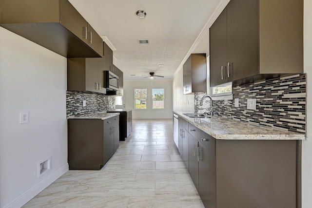 kitchen with ceiling fan, ornamental molding, sink, and stainless steel appliances