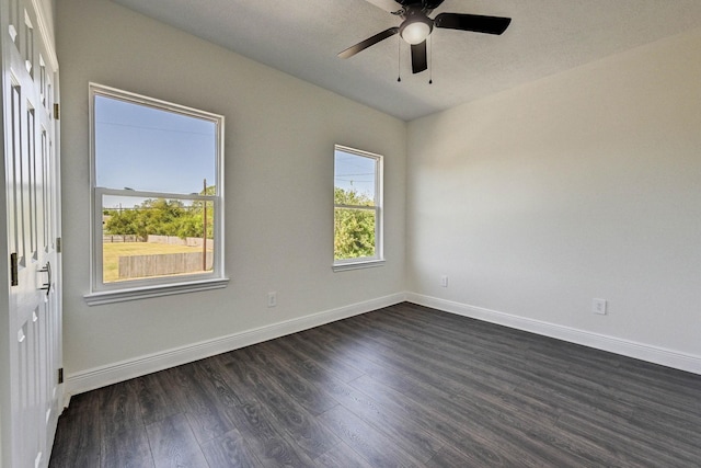 unfurnished room featuring ceiling fan and dark wood-type flooring