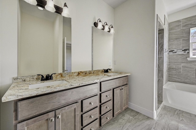 bathroom with tiled shower and vanity