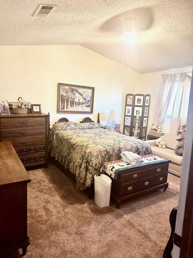 carpeted bedroom featuring lofted ceiling and a textured ceiling