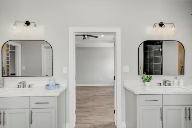 bathroom featuring ceiling fan, vanity, and hardwood / wood-style flooring