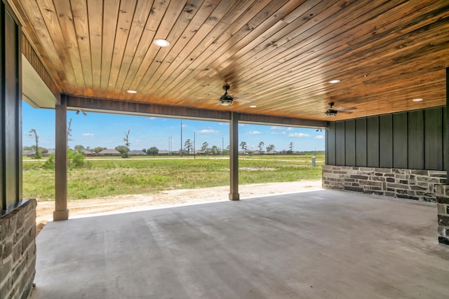 view of patio featuring ceiling fan and a rural view