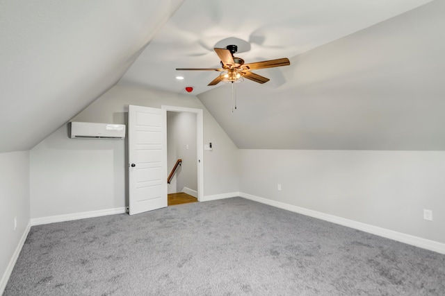 bonus room featuring a wall unit AC, ceiling fan, carpet, and vaulted ceiling