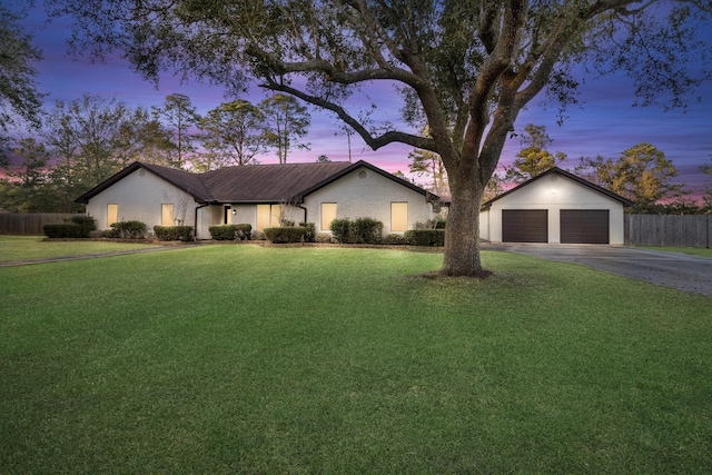 ranch-style house featuring a yard