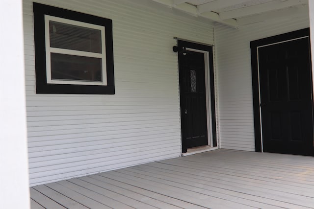 wooden terrace with a porch