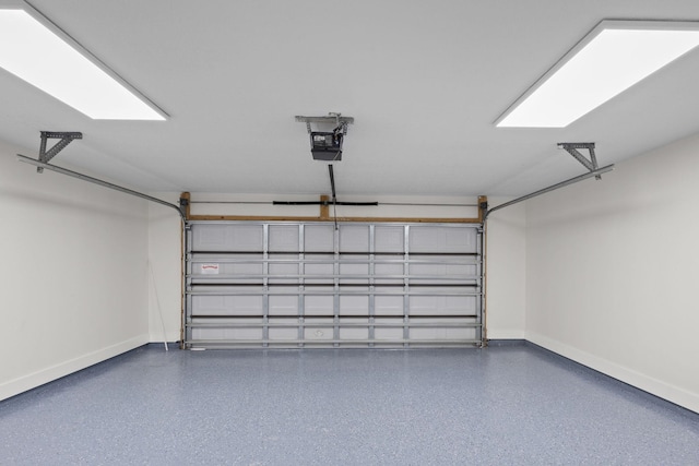 garage with baseboards and a garage door opener