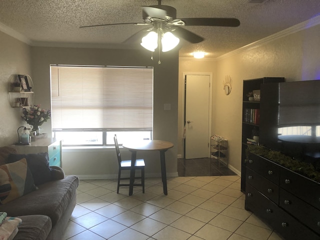 dining area with light tile patterned floors, a textured ceiling, and crown molding