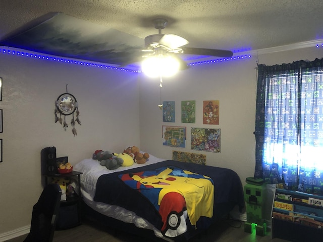 bedroom featuring a textured ceiling and a ceiling fan