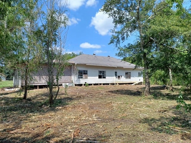 back of property with a deck