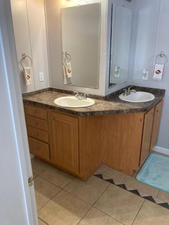 bathroom with tile patterned flooring and vanity