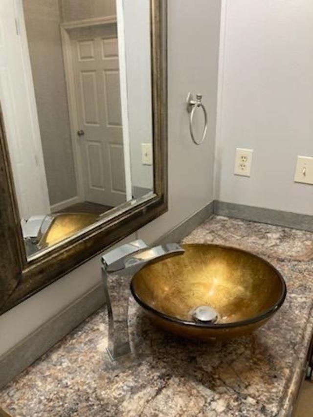 bathroom with curtained shower, a textured ceiling, tile patterned floors, vanity, and toilet