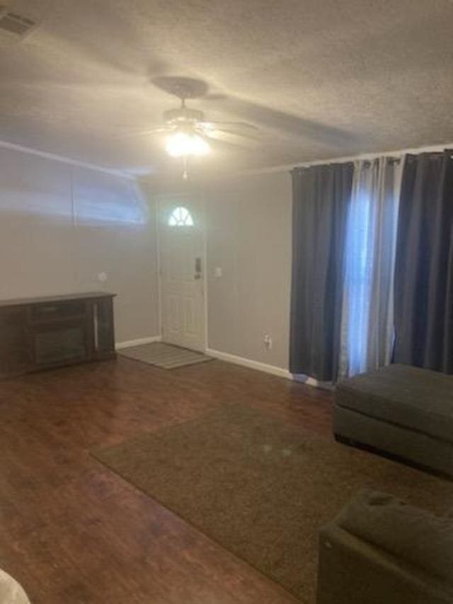 entryway with dark hardwood / wood-style flooring