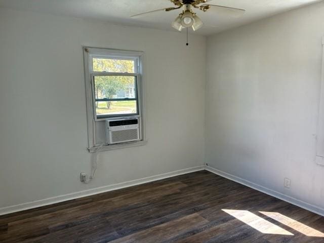 unfurnished room with ceiling fan and dark hardwood / wood-style flooring