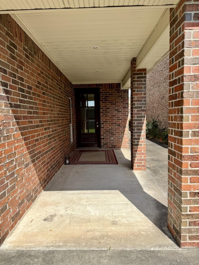6400 Chasse Gdns, Little Cypress, TX 77632 - doorway to property with brick siding