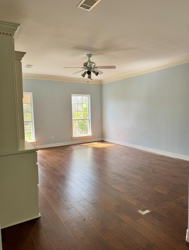 6400 Chasse Gdns, Little Cypress, TX 77632 - spare room with crown molding, plenty of natural light, a ceiling fan, baseboards, and dark wood-style floors