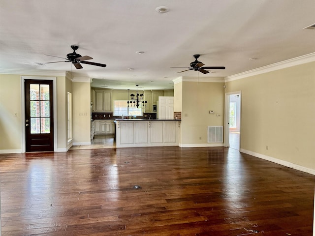 6400 Chasse Gdns, Little Cypress, TX 77632 - unfurnished living room featuring a ceiling fan, dark wood-style floors, baseboards, and crown molding